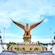 A large eagle statue with wings fully spread standing on a pedestal with a sign that reads ‘Langkawi’